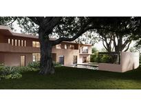 Tranquil backyard with a pool, lush landscaping, and mature trees at 1260 Wellington Dr, Clearwater, FL 33764