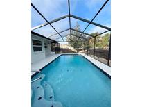 Inviting screened pool with ample deck space at 12571 Corrine Ave, Spring Hill, FL 34609