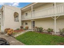 Condo building exterior with landscaping and parking at 2625 State Road 590 # 622, Clearwater, FL 33759