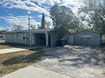Front exterior of a single-story home with a carport and driveway at 1386 19Th St, Sarasota, FL 34234