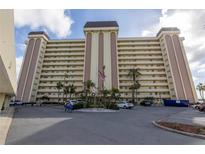 High-rise building with parking and landscaping at 4775 Cove Cir # 904, St Petersburg, FL 33708