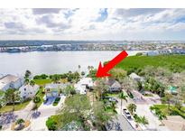 An aerial view of a waterfront home in a residential neighborhood at 307 10Th Ave, Indian Rocks Beach, FL 33785