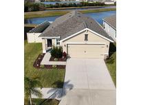 Charming single-story home with a two-car garage and landscaped front yard at 11425 Stone Pine St, Riverview, FL 33569