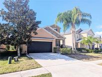 Attractive two-story home with a two-car garage and landscaped yard at 18844 Hampstead Heath Ct, Land O Lakes, FL 34638