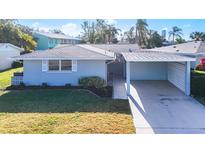 Updated single story home with carport and well maintained landscaping at 2460 Terry Ln, Sarasota, FL 34231