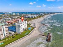 Stunning aerial view of a beachfront property with ocean views at 7000 Beach Plz # 706, St Pete Beach, FL 33706