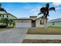 One-story home with a two-car garage and landscaped yard at 442 Bahama Grande Blvd, Apollo Beach, FL 33572