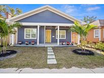 Charming craftsman home with a welcoming front porch and nicely landscaped lawn at 1716 22Nd N Ave, St Petersburg, FL 33713