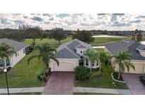 Property view showcasing the home's location and surrounding golf course at 1847 Pacific Dunes Dr, Sun City Center, FL 33573