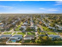 Aerial view of a residential neighborhood with single-Gathering homes and lush landscaping at 9167 108Th St, Seminole, FL 33772