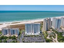 Aerial view of beachfront property with surrounding buildings and ocean views at 1230 Gulf Blvd # 402, Clearwater Beach, FL 33767