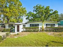Charming single-story home with a well-maintained lawn and lush landscaping, perfect for curb appeal at 7235 12Th N Ave, St Petersburg, FL 33710