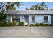 Front view of a light blue house with landscaping at 3636 Trophy Blvd # 3636, New Port Richey, FL 34655