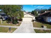 House exterior featuring a two-car garage and well-maintained landscaping at 1716 Westerly Dr, Brandon, FL 33511