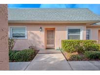 Exterior view of condo with walkway and landscaping at 3743 Teeside Dr, New Port Richey, FL 34655