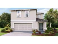 Two-story house with attached garage and landscaping at 5253 Salt Marsh Rd, Wimauma, FL 33598