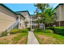 Exterior view of condo building with landscaping and walkway at 10110 Winsford Oak Blvd # 612, Tampa, FL 33624