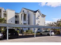 Covered parking area with parking spaces for residents at 3127 W Sligh Ave # 203B, Tampa, FL 33614