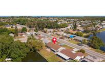 Aerial view of a single-Gathering home with water access at 3438 Moog Rd, Holiday, FL 34691