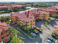 Aerial view of condo building showcasing the property's location and surrounding area at 2733 Via Cipriani # 830A, Clearwater, FL 33764