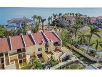 Beautiful coastal condominium with a red tile roof, private patios, and stunning water views at 7550 Sunshine Skyway S Ln # T48, St Petersburg, FL 33711