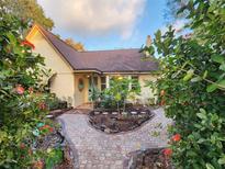 Brick pathway leads to charming bungalow with well-manicured landscaping at 2614 52Nd S St, Gulfport, FL 33707