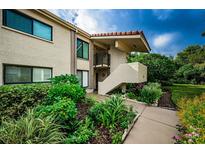 Attractive condo building with lush landscaping and walkway at 6382 Palma Del Mar S Blvd # 123, St Petersburg, FL 33715