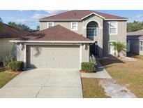 Two-story house with attached garage. Well maintained at 6213 Venezia Pl, Riverview, FL 33578