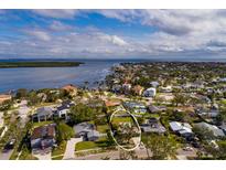 Aerial view of a single Gathering home with pool and large backyard in a quiet residential neighborhood at 5801 Venetian Ne Blvd, St Petersburg, FL 33703