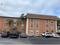 Two-story building exterior with ample parking at 12760 Indian Rocks Rd # 562, Largo, FL 33774