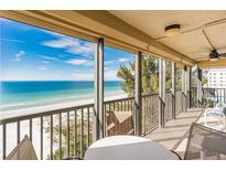Spacious balcony with ocean view and seating for relaxation at 20040 Gulf Blvd # 605, Indian Shores, FL 33785