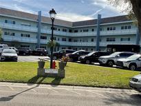 South Seas condo building, 2255, with parking lot and landscaping at 2255 Philippine Dr # 35, Clearwater, FL 33763