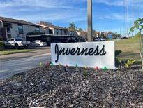 Attractive community entrance sign with landscaping at 2593 Countryside Blvd # 7213, Clearwater, FL 33761