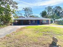 Brick ranch house with carport and large yard at 3004 S West Shore Blvd, Tampa, FL 33629