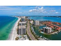 Aerial view of waterfront property with ocean and marina views at 1660 Gulf Blvd # 706, Clearwater Beach, FL 33767