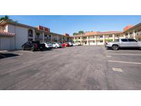 Spacious parking lot providing ample parking for residents in front of the apartment community at 19029 Us Highway 19 N # 5-1, Clearwater, FL 33764