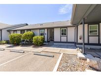 Exterior view of condo with parking and landscaping at 4925 New England Blvd # 204, New Port Richey, FL 34652