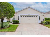 Attractive single-story home with a two-car garage and nicely landscaped yard at 20853 Eustis Rd, Land O Lakes, FL 34637