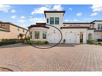 Two-story townhome with two-car garage and attractive landscaping at 10043 Crooked Creek Dr # 101, Venice, FL 34293