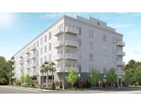 Modern apartment building with multiple balconies and landscaped grounds at 600 3Rd S Ave # 405, St Petersburg, FL 33701