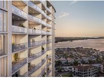 Luxury high-rise building with balconies offering stunning water views at 5701 Bowen Daniel Dr. # 402, Tampa, FL 33616