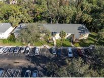 Aerial view of condo building with ample parking at 3001 58Th S Ave # 901, St Petersburg, FL 33712