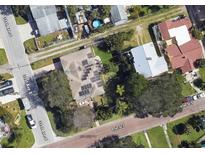 Aerial view of home showcasing solar panels, landscaping, and neighborhood surroundings at 3102 57Th S St, Gulfport, FL 33707