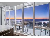 Relaxing balcony showcases stunning city and ocean views with comfortable seating for enjoying the scenery at 175 1St S St # 3402, St Petersburg, FL 33701