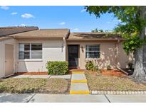 Charming single-story home featuring a well-maintained front yard and inviting entrance at 1033 Bowsprit Ln # 1406, Holiday, FL 34691