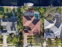 Stunning aerial view of home with pool, boat dock and lush landscaping at 4531 Swordfish Dr, Bradenton, FL 34208