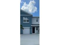 Charming two-story townhome with a one-car garage and modern architectural details at 2746 Pearly Banks Dr, Bradenton, FL 34208