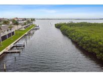 Waterfront condos feature private docks and boat slips, offering direct access to bay waters at 8829 Bay Pointe Dr # 205, Tampa, FL 33615