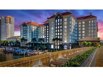Stunning waterfront condo building with a marina, lush landscaping, and gorgeous architecture at 700 S Harbour Island Blvd # 226, Tampa, FL 33602