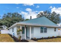 Charming single-story home with a fresh exterior, manicured landscaping, and inviting front porch at 5718 Magnolia N St, St Petersburg, FL 33703